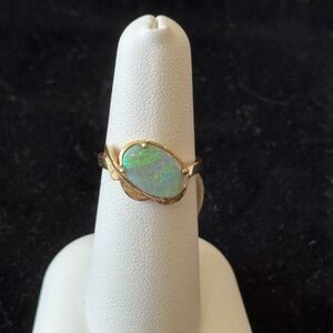 14K yellow gold with a stunning Oval Fire Opal stone SZ: 7